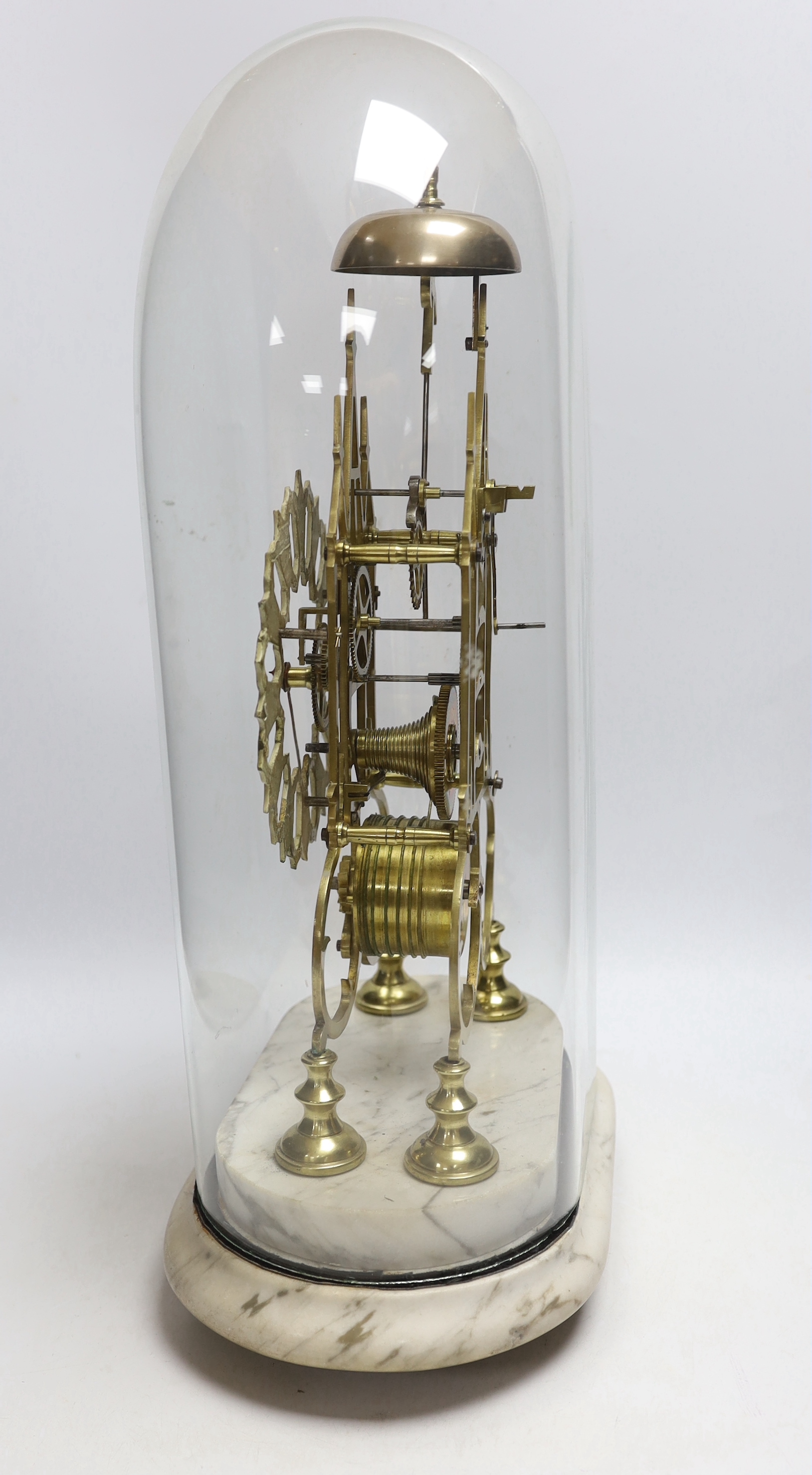 A 19th century brass skeleton clock under dome on shaped grey marble base, 49cm high